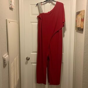 A formal jumpsuit with the sequence right shoulder strap. Brand is R&M Richards.